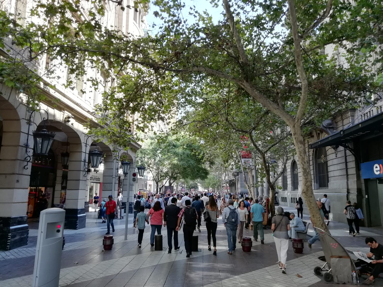 Paseo Ahumada, a tree-lined pedestrian street full of people